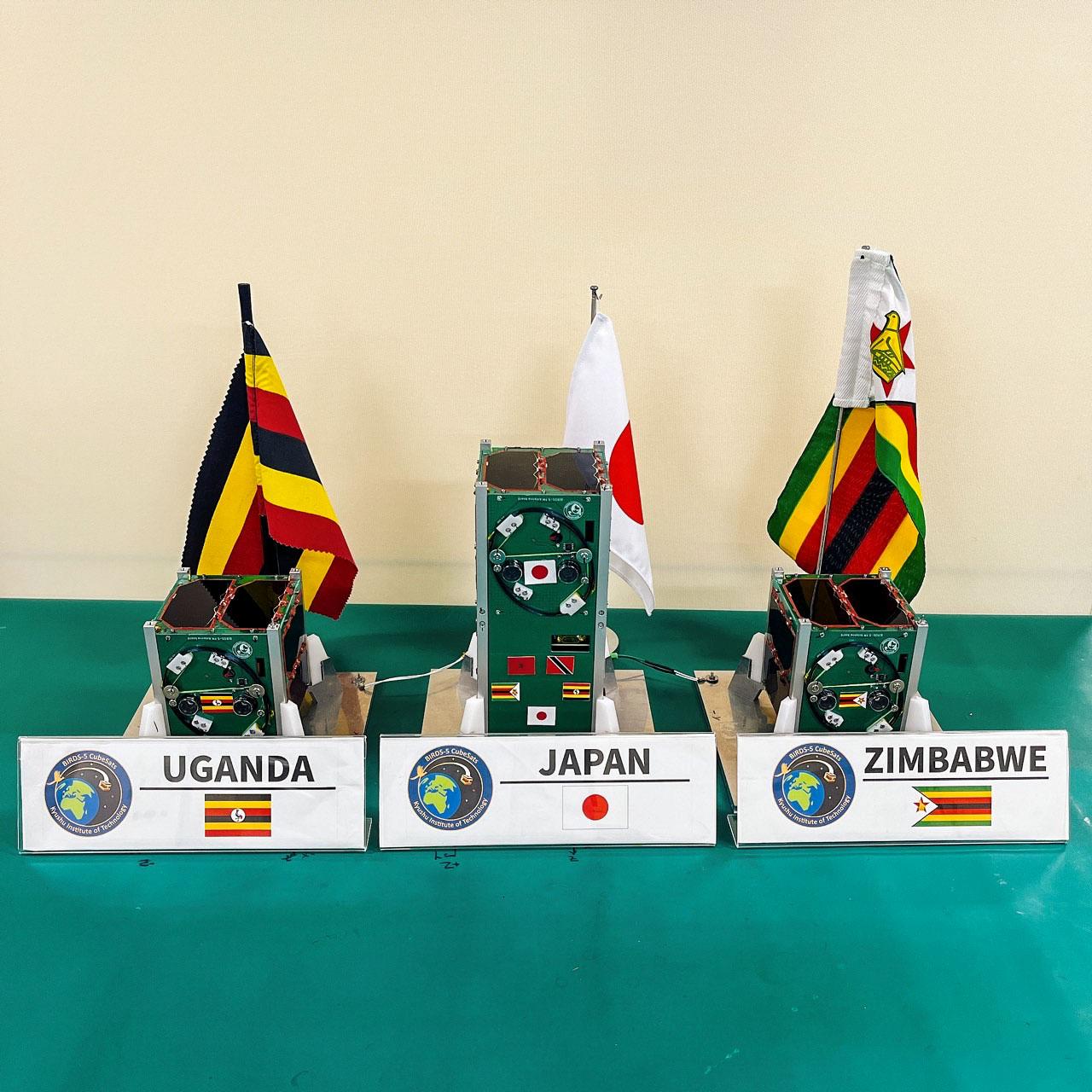 jsc2022e072958 (9/22/2022) --- The BIRDS-5 satellite constellation developed by Uganda, Zimbabwe, and Japan sits on table prior to launch. Since 2015, the Japanese Kyushu Institute of Technology, or Kyutech, has been carrying out the BIRDS program with the goals of capacity building and fostering a long-term and sustainable space organization in participating nations. Image courtesy of BIRDS-5