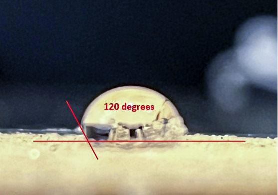 jsc2022e072961 (9/16/2022) --- Researchers drop a water droplet on the flat surface of hydrophobic fine sand. The water droplet has a contact angle of 120 degrees at the three-phase interface. The water droplet stands up and has a more rounded shape than a flattened shape compared to normal hydrophilic sand. Catastrophic Post-Wildfire Mudflows studies the formation and stability of this bubble-sand structure in microgravity. A better understanding of these phenomena could improve the understanding, modeling, and predicting of mudflows and support development of innovative solutions to prevent catastrophic post-fire events. Image courtesy of the UCSD Geo-Micromechanics Research Group.