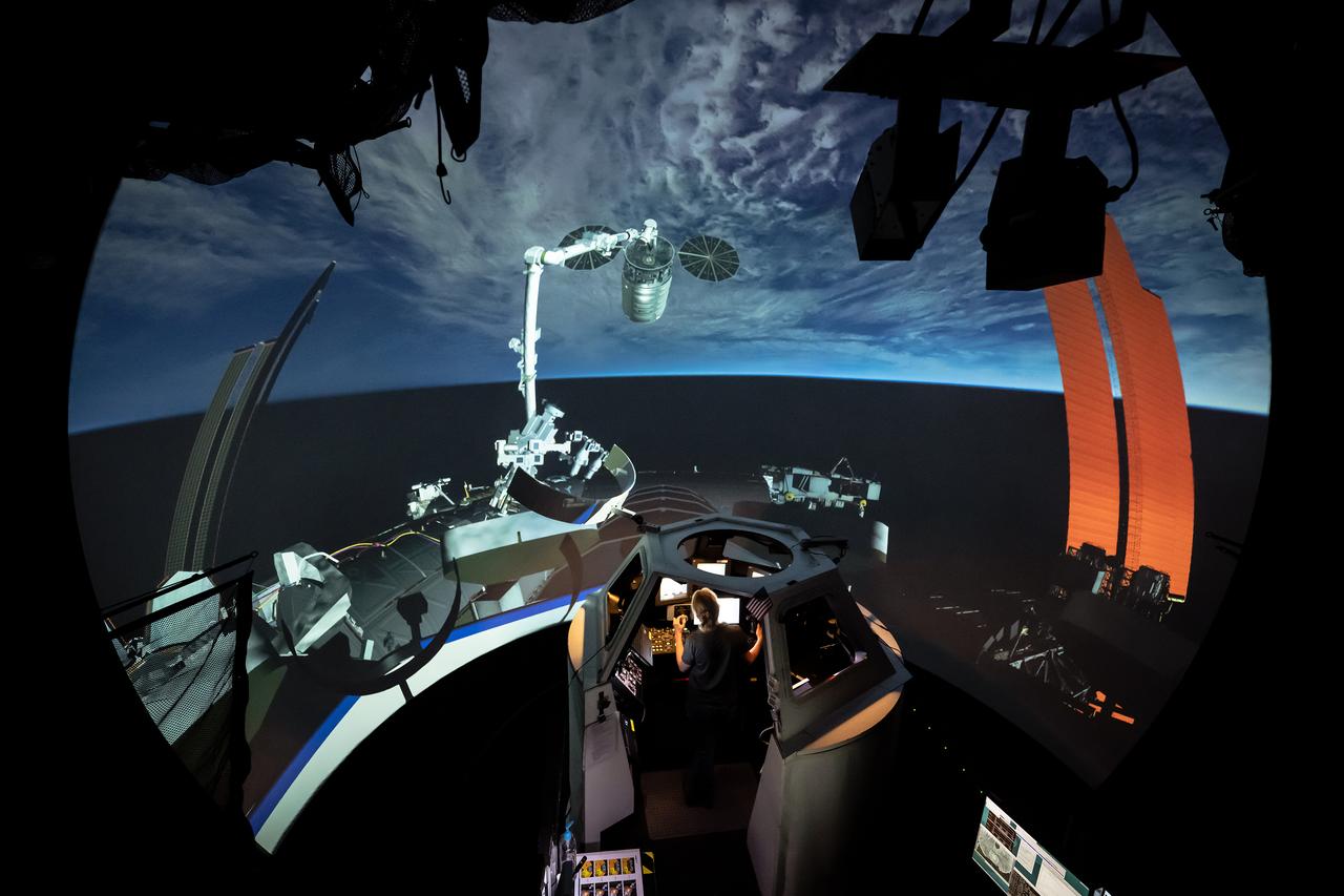 Mastering the art of space robotics, NASA astronaut Loral O’Hara commands the virtual frontier from the mock-up cupola in the Systems Engineering Simulator at NASA’s Johnson Space Center, providing a glimpse into the intense training and preparation for missions abord the International Space Station. Photographer: Josh Valcarcel – Johnson Space Center 