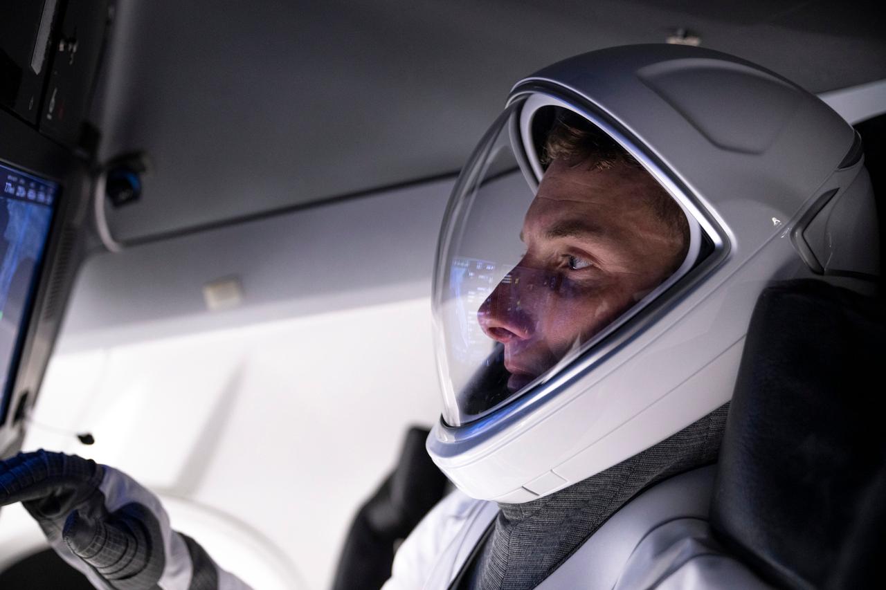 jsc2022e079353 (Sept. 25, 2022) --- SpaceX Crew-6 Pilot Warren "Woody" Hoburg of NASA is pictured training inside a Dragon mockup crew vehicle at the company's headquarters in Hawthorne, California. Credit: SpaceX