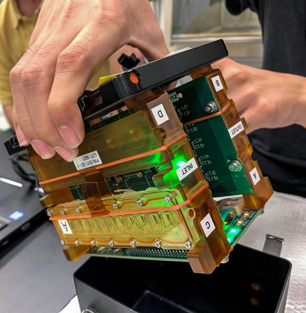 jsc2022e083016 (10/26/2022) --- A preflight image of tissue chambers loaded into the plate habitat (pHAB) for A Human iPSC-based 3D Microphysiological System for Modeling Cardiac Dysfunction in Microgravity (Engineered Heart Tissues-2) investigation. The tissue chambers are placed inside the pHAB lid, creating a fully enclosed system for functional measurements and long-term tissue culture in microgravity. Image courtesy of Johns Hopkins University.
