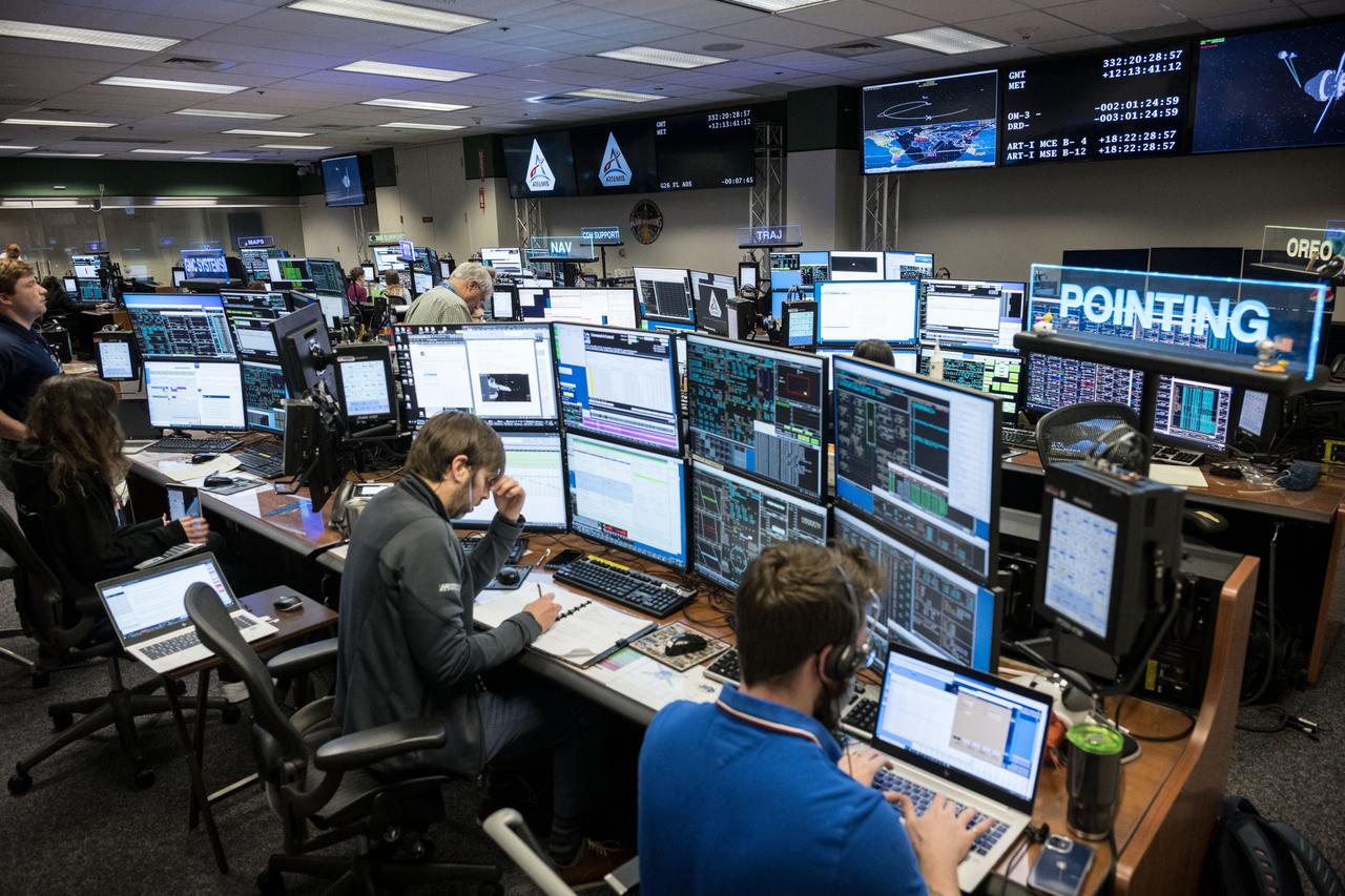jsc2022e090102 (Nov. 28, 2022): Flight controllers observe the Orion spacecraft under the direction of Flight Director Paul Konyha. The spacecraft reached its maximum distance from the Earth on flight day 14 of the Artemis I mission, flying nearly 270,000 miles away from the Earth. Credit: NASA/Robert Markowitz