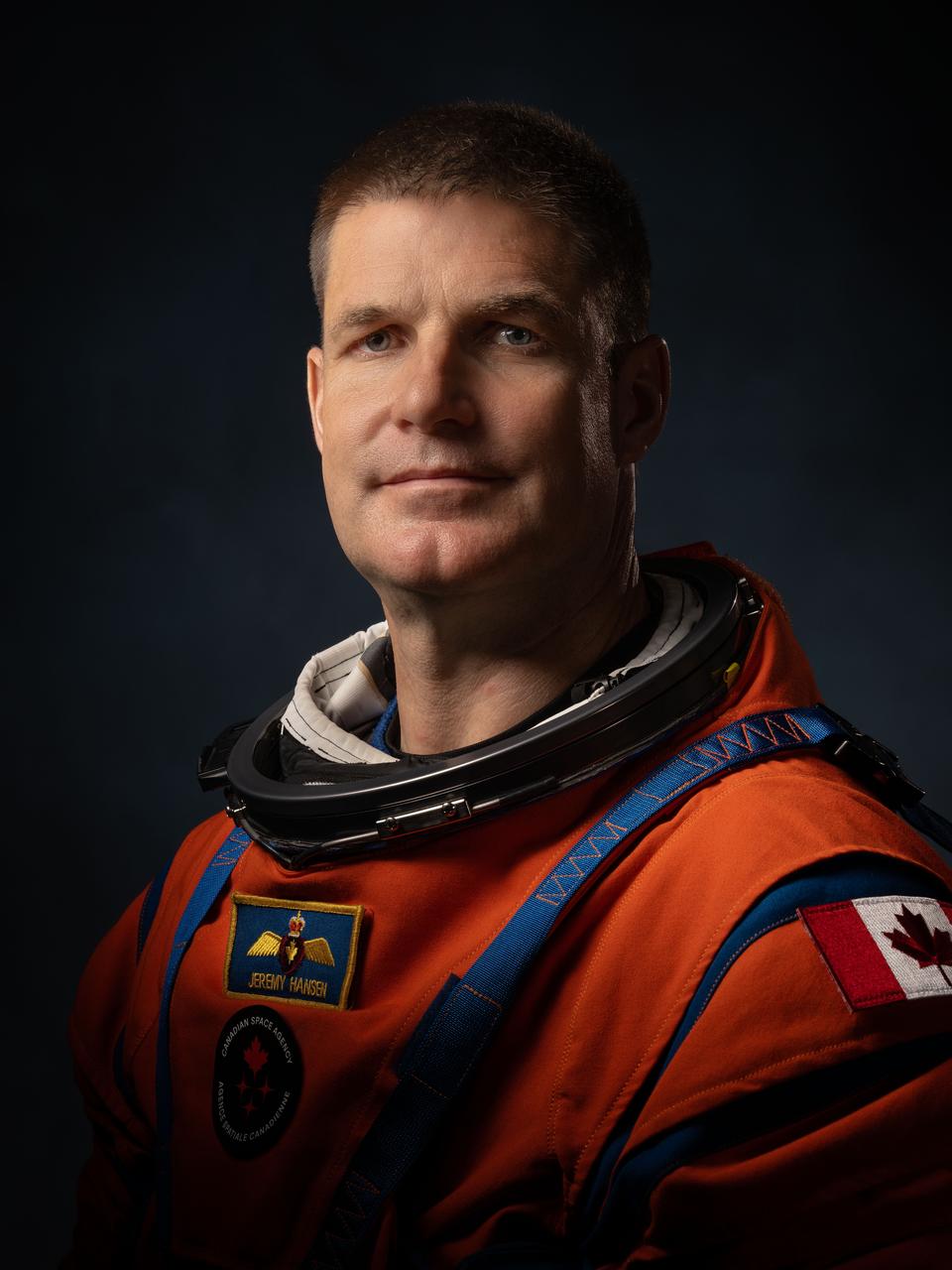 Canadian Space Agency Astronaut Jeremy Hansen is making his first flight to space as a mission specialist on the Artemis II mission. He was one of two recruits selected by CSA in May 2009 through the third Canadian Astronaut Recruitment Campaign and has served in many roles supporting human spaceflight. Hansen has served as Capcom in NASA's Mission Control Center at the Johnson Space Center and in 2017, became the first Canadian to be entrusted with leading a NASA astronaut class, leading the training of astronaut candidates from the United States and Canada. PHOTOGRAPHER: Josh Valcarcel  This image was modified to include CSA’s insignia on the center front of Hansen’s spacesuit. The insignia was not available at the time of the photo. It will be on Hansen’s suit for Artemis II.