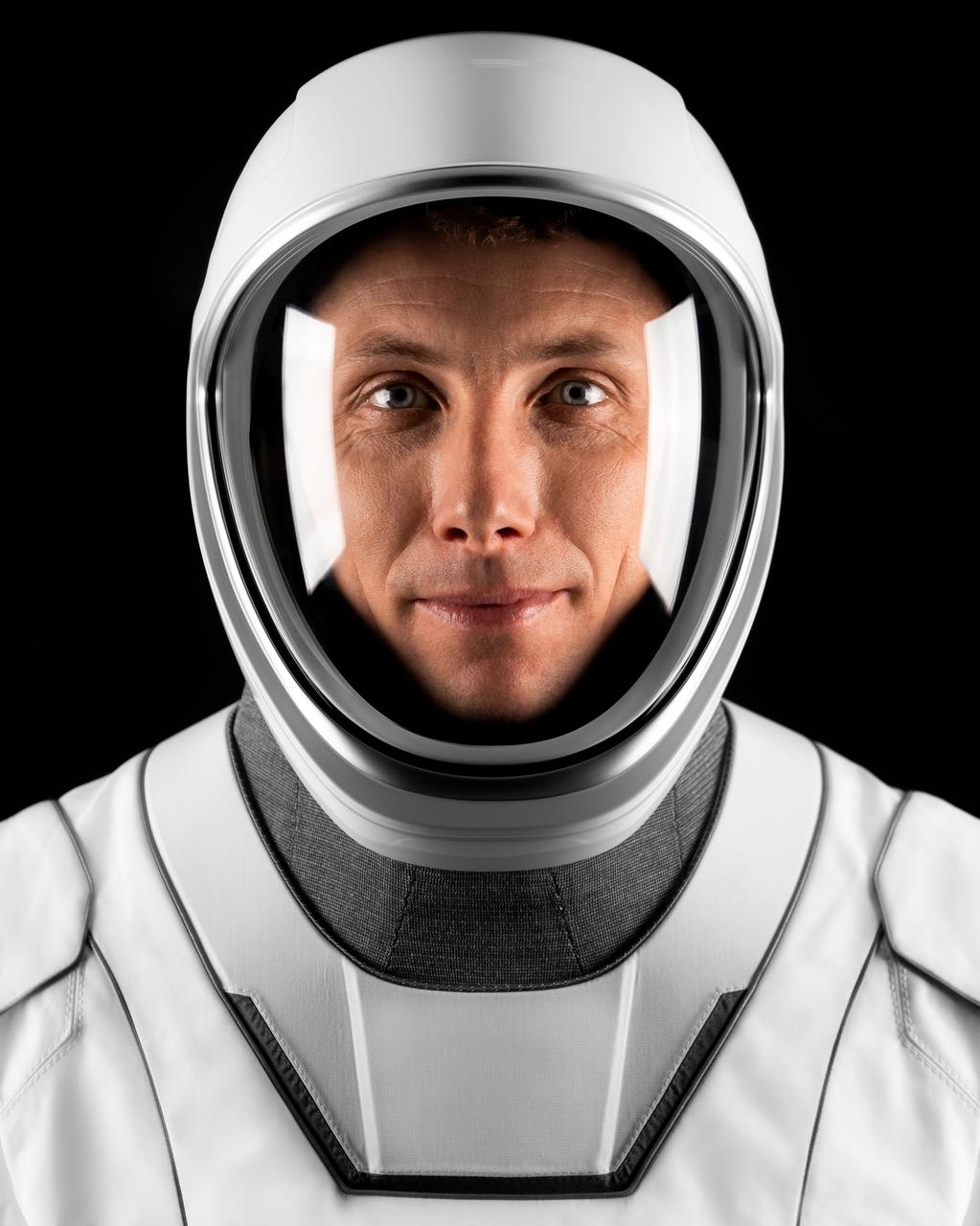 jsc2023e005731 (Jan. 29, 2023) --- Astronaut Warren "Woody" Hoburg of NASA's Commercial Crew Program, SpaceX Crew-6 Pilot, poses for a portrait in his pressure suit at SpaceX headquarters in Hawthorne, California. Credit: SpaceX