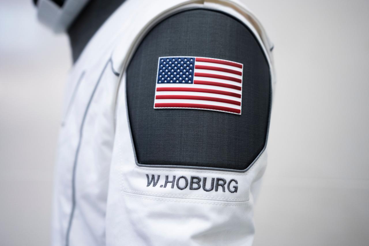 jsc2023e005736 (Jan. 30, 2023) --- A SpaceX launch and entry suit bears an American flag, and the name of NASA astronaut Warren "Woody" Hoburg, who will serve as the pilot of NASA's SpaceX Crew-6 mission to the International Space Station. Credit: SpaceX