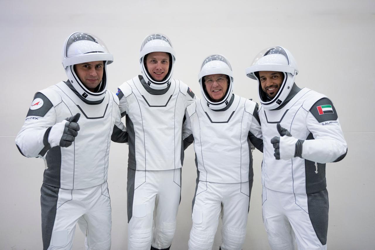 jsc2023e005746 (Jan. 30, 2023) --- The four crew members that comprise the SpaceX Crew-6 mission pose for a portrait during a crew equipment integration test at the company's headquarters in Hawthorne, California. From left, in their pressure suits are, Mission Specialist Andrey Fedyaev of Roscosmos; Pilot Warren "Woody" Hoburg and Commander Stephen Bowen, both from NASA; and Mission Specialist Sultan Alneyadi from the Mohammed bin Rashid Space Centre. Credit: SpaceX