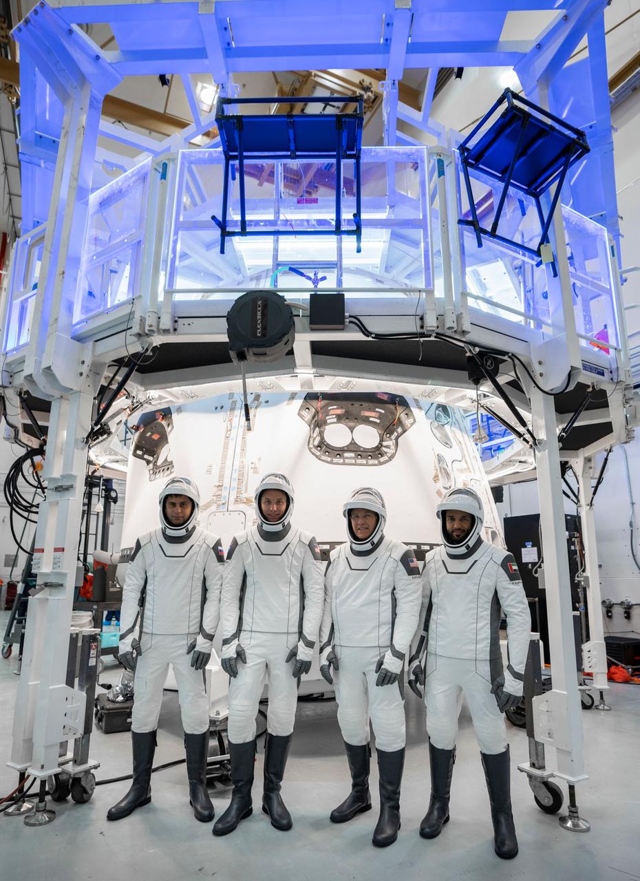 jsc2023e005750 (Jan. 30, 2023) --- The four crew members that comprise the SpaceX Crew-6 mission are pictured in front of the SpaceX Dragon crew ship during a crew equipment integration test at SpaceX headquarters in Hawthorne, California. From left, in their pressure suits are, Mission Specialist Andrey Fedyaev of Roscosmos; Pilot Warren "Woody" Hoburg and Commander Stephen Bowen, both from NASA; and Mission Specialist Sultan Alneyadi from the Mohammed bin Rashid Space Centre. Credit: SpaceX