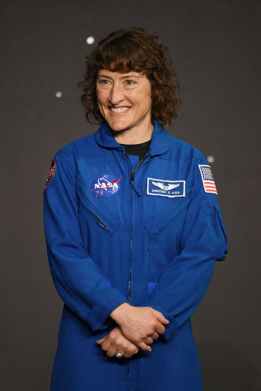 jsc2023e017055 (April 4, 2023) -- NASA astronaut Christina Koch is announced as one of four members of the Artemis II crew that will travel around the Moon. Koch was joined by fellow NASA astronauts Reid Wiseman, Victor Glover, and, and CSA (Canadian Space Agency) astronaut Jeremy Hansen during a Monday, April 3, 2023, crew announcement news conference at Ellington Field near NASA’s Johnson Space Center. The crew is comprised of Commander Reid Wiseman, Pilot Victor Glover, and Mission Specialists Christina Koch and Jeremy Hansen. The four astronauts will venture around the Moon on Artemis II, the first crewed mission on NASA’s path to establishing a long-term presence at the Moon for science and exploration through Artemis. Photo by James Blair.