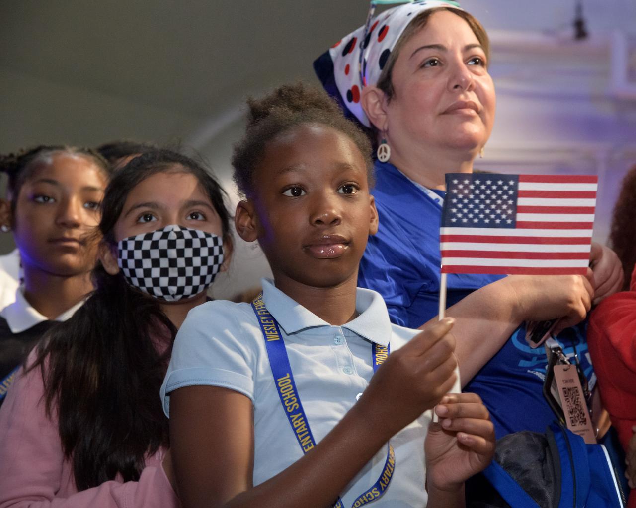 jsc2023e017087 (April 3, 2023) – – Houston students from Davila Elementary and Wesley Elementary attend the Monday, April 3, 2023, announcement of the Artemis II crew at Ellington Field near NASA’s Johnson Space Center. The crew is comprised of Commander Reid Wiseman, Pilot Victor Glover, and Mission Specialists Christina Koch and Jeremy Hansen. The four astronauts will venture around the Moon on Artemis II, the first crewed mission on NASA’s path to establishing a long-term presence at the Moon for science and exploration through Artemis.