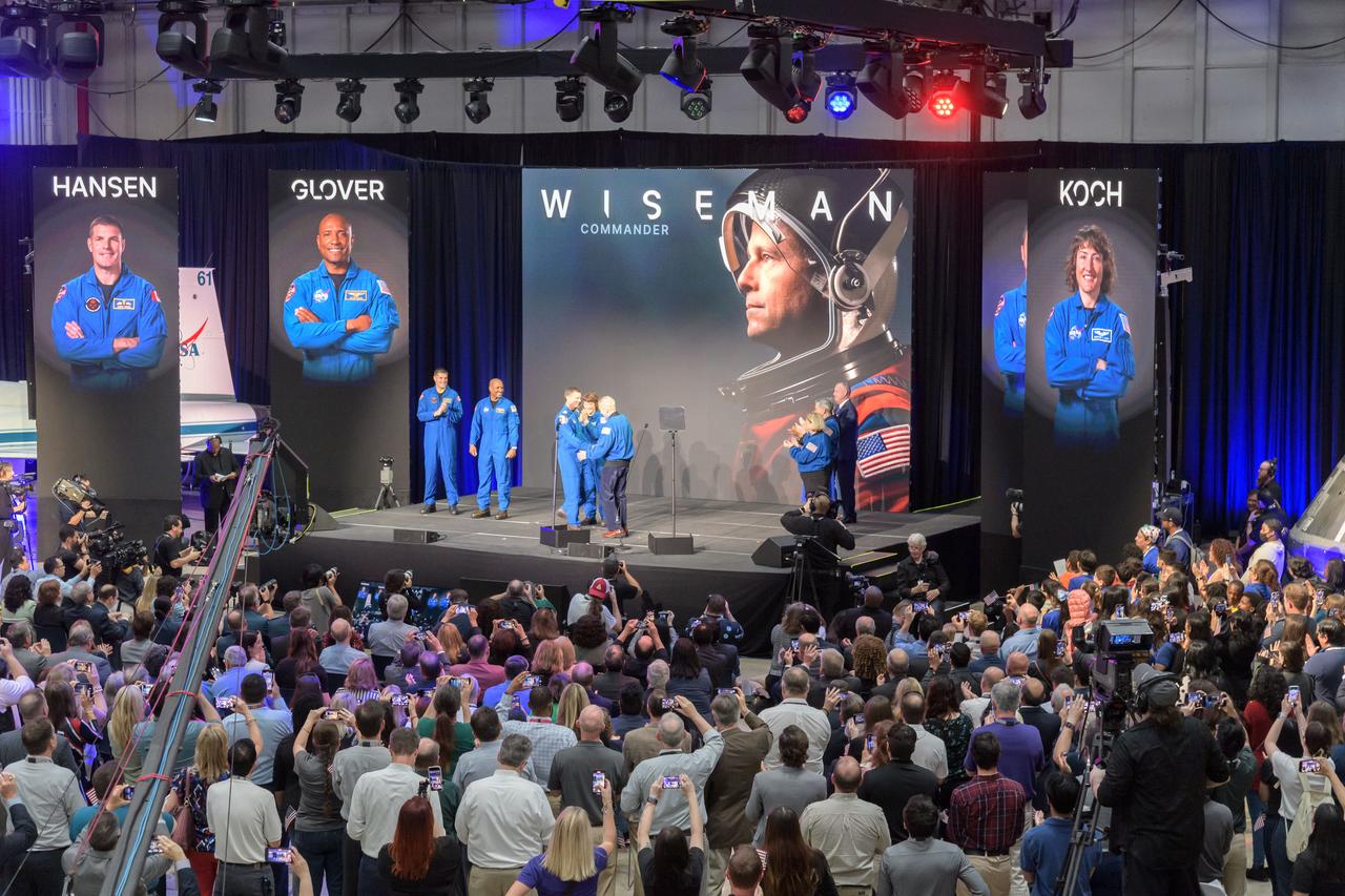 jsc2023e017914 (April 3, 2023) -- NASA astronauts Reid Wiseman, Victor Glover and Christina Koch, and CSA (Canadian Space Agency) astronaut Jeremy Hansen are announced as members of the Artemis II crew that will travel around the Moon during a Monday, April 3, 2023, crew announcement news conference at Ellington Field near NASA’s Johnson Space Center in Houston. The crew is comprised of Commander Reid Wiseman, Pilot Victor Glover, and Mission Specialists Christina Koch and Jeremy Hansen. The four astronauts will venture around the Moon on Artemis II, the first crewed mission on NASA’s path to establishing a long-term presence at the Moon for science and exploration through Artemis.