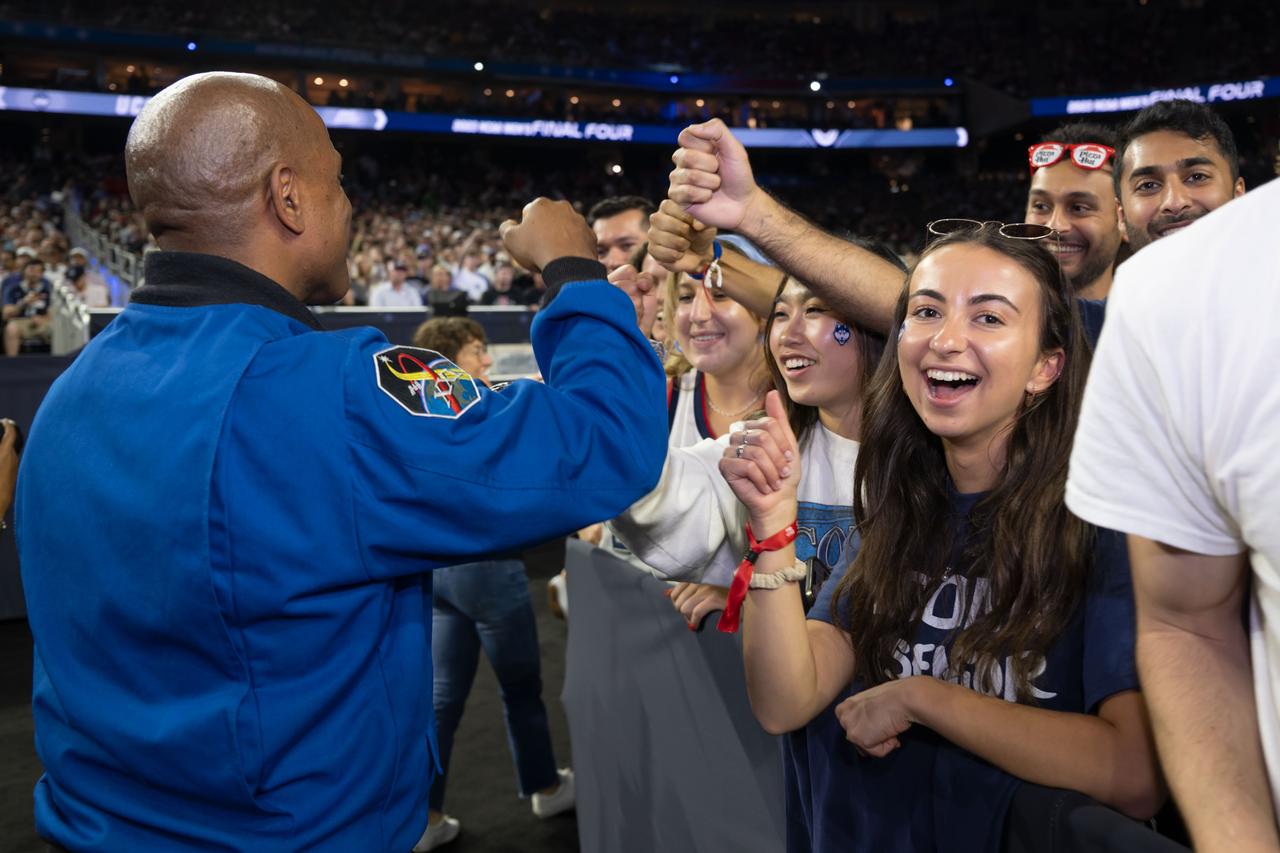 jsc2023e018330 (April 3, 2023) – NASA astronaut Artemis II Pilot Victor Glover greets fans while attending the NCAA Men’s Final Four national championship game at NRG Stadium in Houston. The crew is comprised of Commander Reid Wiseman, Pilot Victor Glover, and Mission Specialists Christina Koch and Jeremy Hansen. The four astronauts will venture around the Moon on Artemis II, the first crewed mission on NASA’s path to establishing a long-term presence at the Moon for science and exploration through Artemis.