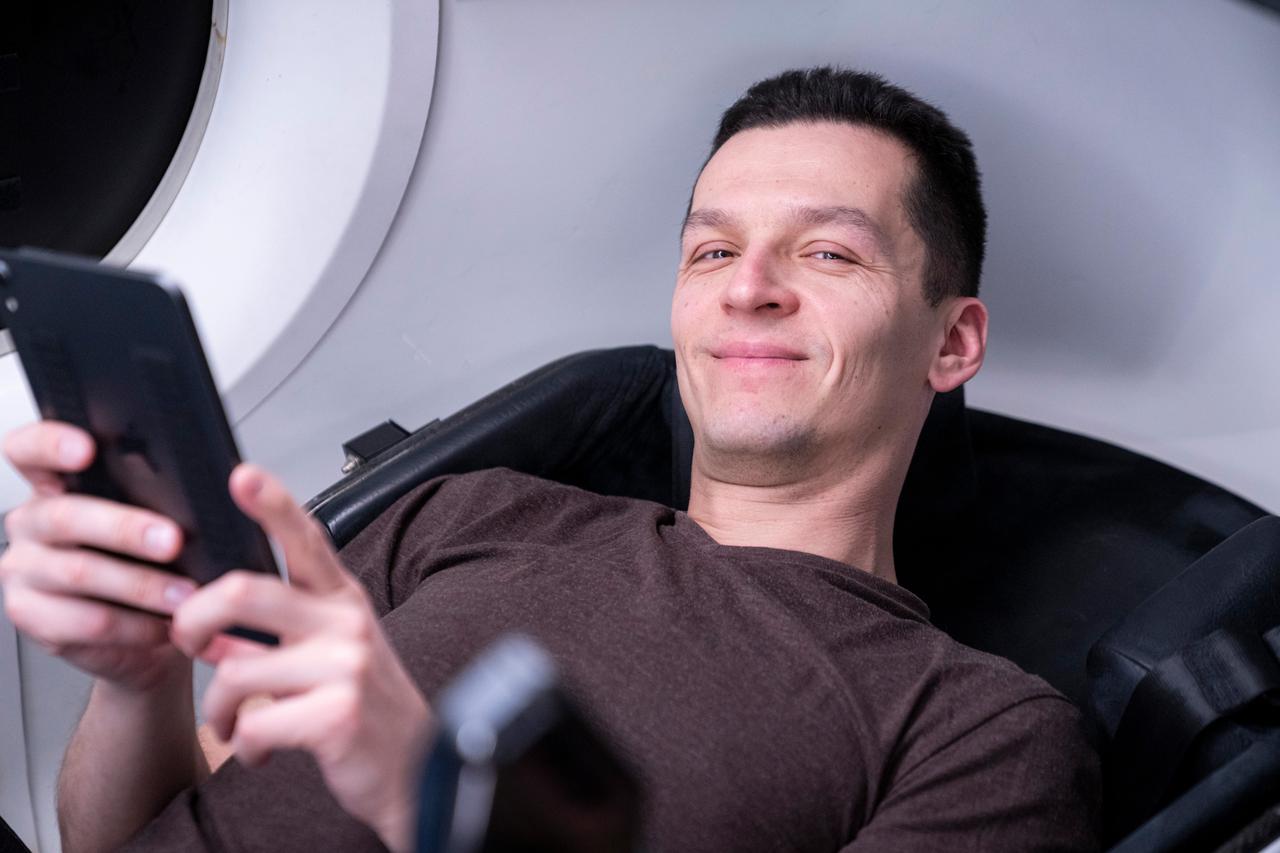 NASA's SpaceX Crew-7 crew traveled to SpaceX in Hawthorne, California during a trip to train for their International Space Station mission. Konstantin Borisov smiles for a photograph. Imagery provided by SpaceX
