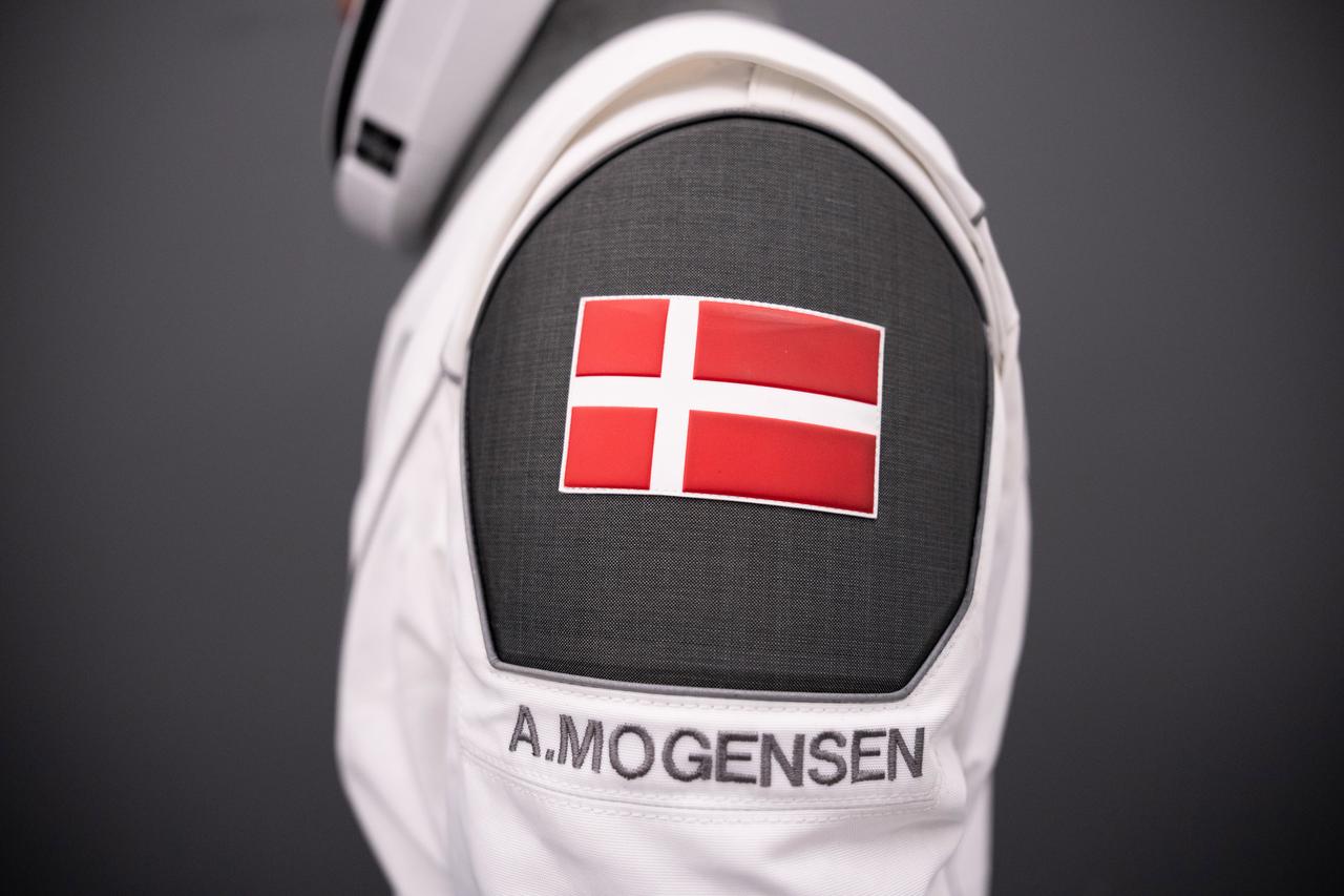 NASA's SpaceX Crew-7 astronaut Andreas Mogensen poses for a photo, displaying the flag of his native Denmark. Imagery provided by SpaceX.