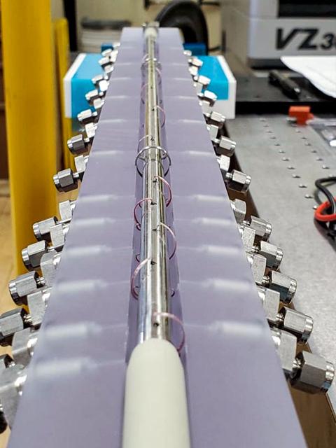 jsc2023e038724 (6/28/2023) --- An interior view of the FBCE-CM-HT test section. Test fluid is vaporized and pumped through the steel tube embedded in an insulating material while space station cooling water is flown around the outer annulus of the steel tube causing the internal vapor to condense. Both cooling water and test fluid temperatures are measured using a system of.thermocouples to calculate heat transfer. Image courtesy of NASA Glenn Research Center..