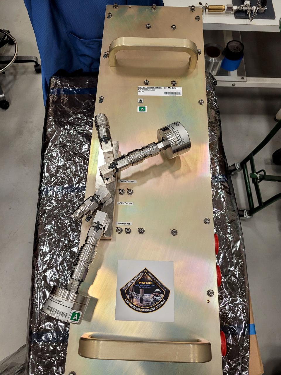 jsc2023e038726 (1/17/2023) --- Top view of the FBCE-CM-HT hardware. This investigation gathers data to characterize the function of condensation surfaces and to validate flow velocity models. Results could identify optimal flow rates at various gravitational levels to safely dissipate heat, supporting design of systems for use in space and on Earth. Image courtesy of NASA Glenn Research Center.