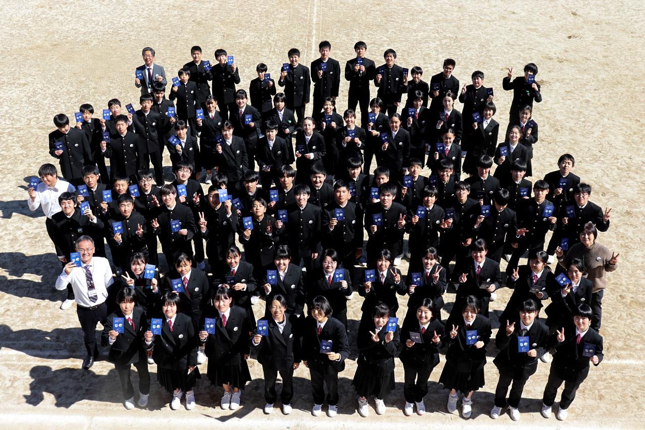 jsc2023e038729 (6/22/2023) --- Students at Misho Junior High School in Ehime, Japan hold Hoshi-Tomo badges. Two types of Hoshi-Tomo badges were designed by students. “Hoshi” implies star(s), planet(s), or the Earth in Japanese. “Tomo” means friend(s) in Japanese. I-Space Essay provides students and teachers the online opportunity to create wishes, which are delivered to the International Space Station's Japanese Experimental Module Kibo. Image courtesy of Mitsumura-Tosho and IHI Corporation.