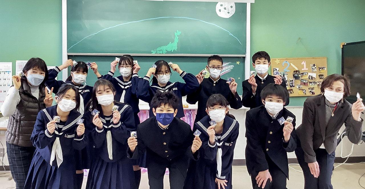 jsc2023e038730 (6/22/2023) --- Students at Nara Prefectural School for the Deaf in Nara, Japan hold Hoshi-Tomo badges. Two types of Hoshi-Tomo badges were designed by students. “Hoshi” implies star(s), planet(s), or the Earth in Japanese. “Tomo” means friend(s) in Japanese. I-Space Essay provides students and teachers the online opportunity to create wishes, which are delivered to the International Space Station's Japanese Experimental Module Kibo. Image courtesy of Mitsumura-Tosho and IHI Corporation.