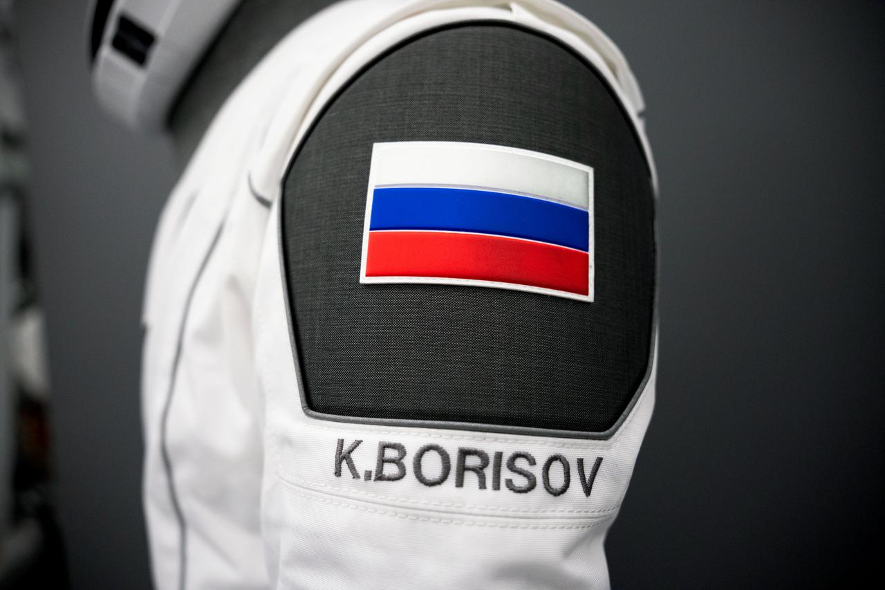 jsc2023e045330 - A SpaceX launch and entry suit bears a Russian flag, and the name of cosmonaut Konstantin Borisov, who will serve as mission specialist of NASA's SpaceX Crew-7 mission to the International Space Station. Credit: SpaceX