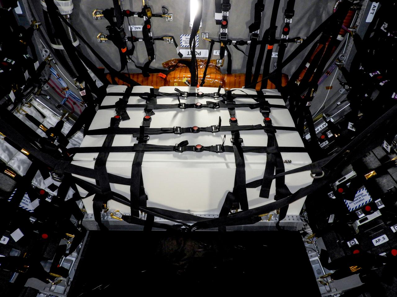 jsc2023e046377 (12/14/2019) --- A view of the Spacecraft Fire Safety Experiments (Saffire) VI experiment hardware, loaded inside the Northrop Grumman (NG) Cygnus cargo vehicle for the 19th NG resupply mission to the International Space Station. Saffire is a series of experiments to investigate how fire spreads on a variety of combustible materials in the microgravity environment. The experiments are ignited in the Cygnus cargo spacecraft after it departs the space station and before it reenters the Earth's atmosphere. Saffire-VI builds on prior results to test flammability at different oxygen levels and aims to further knowledge of realistic flame spread to aid the development of fire safety equipment and strategies for future spacecraft.