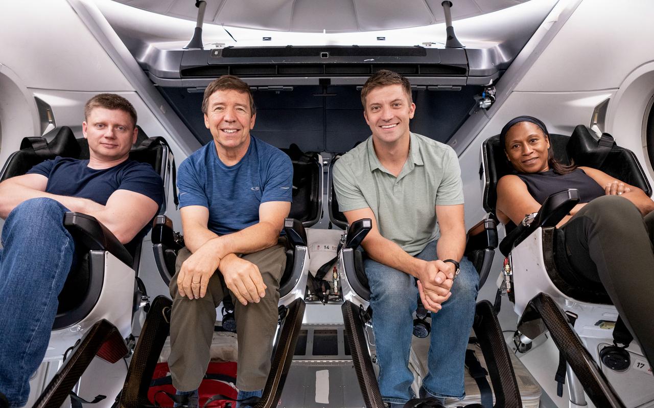 jsc2023e050368 (Aug. 10, 2023) --- Crew-8 poses for a group photo inside the Dragon capsule during their first week of training at SpaceX in Hawthorne, California. From left, are Mission Specialist Aleksandr Grebenkin from Roscosmos, and Pilot Michael Barratt, Commander Matthew Dominick, and Mission Specialist Jeanette Epps, all from NASA. Credit: SpaceX