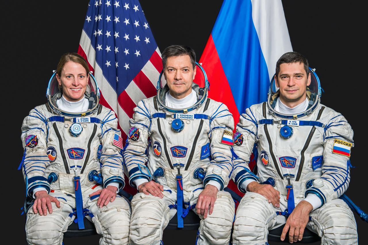 jsc2023e052790 (Oct. 13, 2022) --- Pictured from left, Soyuz MS-24 crew members NASA astronaut Loral O'Hara and Roscosmos cosmonauts Oleg Kononenko and Nikolai Chub pose for a portrait at the Garagarin Cosmonaut Training Center in their Sokol launch and entry suits. Credit: Andrey Shelepin
