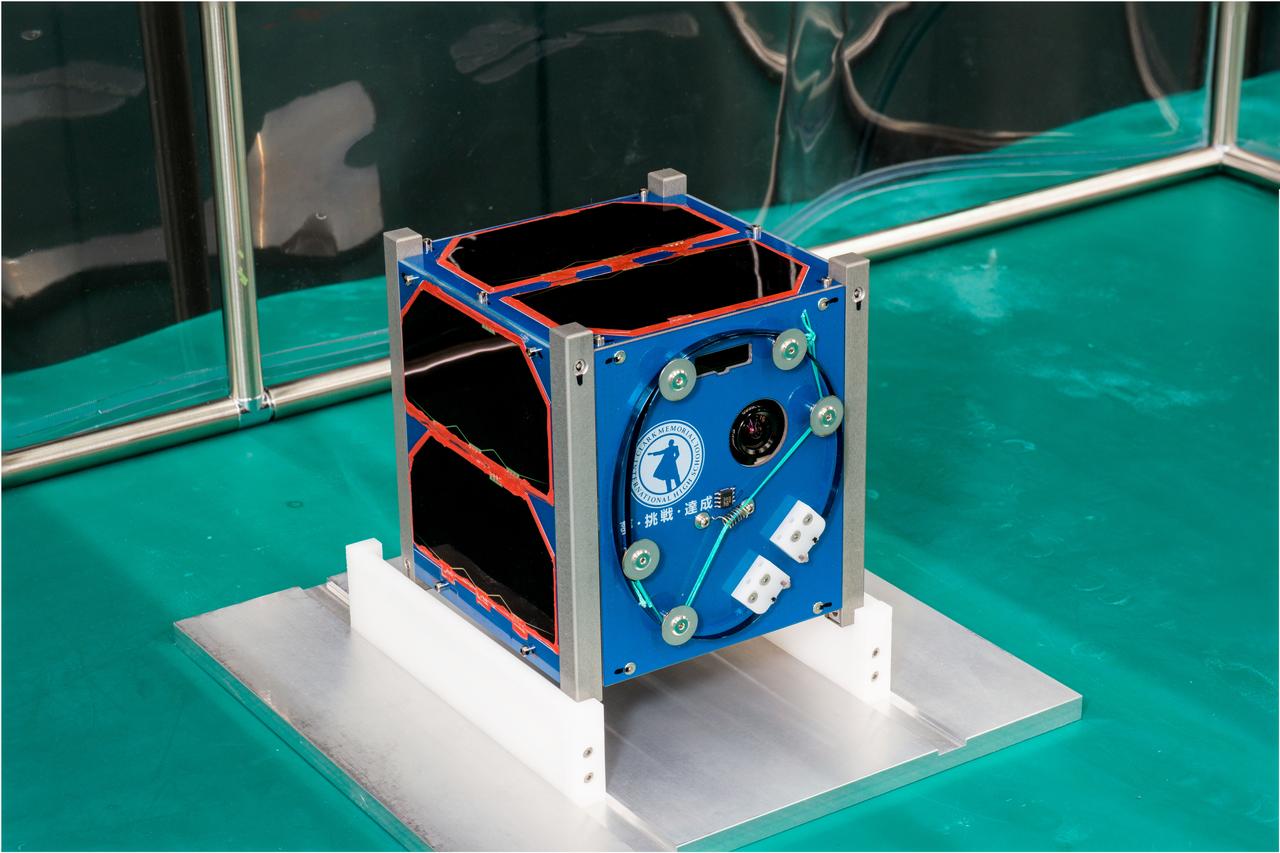 jsc2023e054750 (9/27/2023) --- Clark sat-1 is a 1U size cubesat. The satellite will send voice messages and image data recorded by high school students themselves to ground control stations and general amateur stations. These data will encourage organizations and individuals working on environmental issues on Earth and in space. Image Credit: ArkEdge Space Inc..