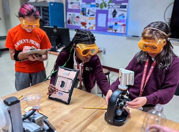 jsc2023e065186 (10/19/2023) --- Student researchers Inari Toledo (left), Sahara Miller (middle), and Siany Lee (right) work on their experiment on how microgravity effects mold growth, which will be included in the Nanoracks-National Center for Earth and Space Science Education-Orbiter-Student Spaceflight Experiments Program Mission 17 to ISS (Nanoracks-NCESSE-Orbiter-SSEP).