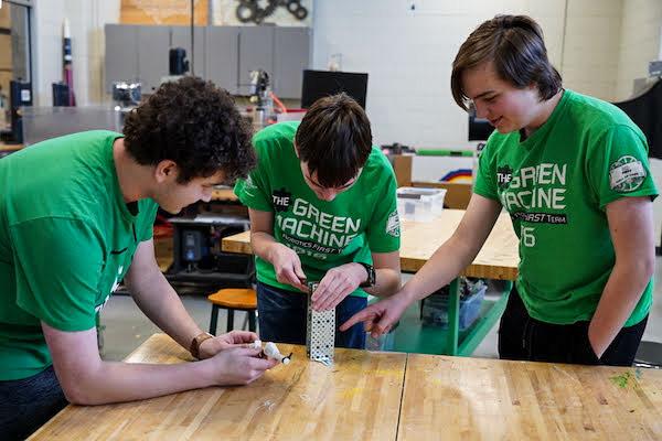jsc2023e065188 (1/27/2023) --- Student researchers work on their experiment, which will be included in the Nanoracks-National Center for Earth and Space Science Education-Orbiter-Student Spaceflight Experiments Program Mission 17 to ISS (Nanoracks-NCESSE-Orbiter-SSEP). Edina High School students Josh Cram, Colin Shaw and Grayson Irons, work together to create a seed holder device meant to minimize vibrations and guide roots of growing bean plants while aboard the ISS.