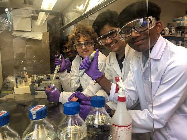 jsc2023e065209 (10/19/2023) --- Student researchers Rishik Yellu, Yatharth Kakkad, Felix Ratner and Rugan Suresh work on their experiment, which will be included in the Nanoracks-National Center for Earth and Space Science Education-Orbiter-Student Spaceflight Experiments Program Mission 17 to ISS (Nanoracks-NCESSE-Orbiter-SSEP).