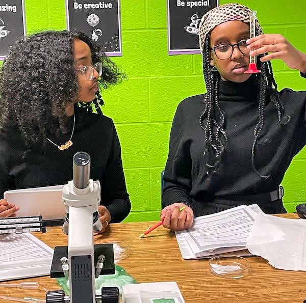 jsc2023e065211 (1/19/2023) --- Harmon Middle School student researchers work on their experiment, Bamboo Growth in Microgravity, which will be included in the Nanoracks-National Center for Earth and Space Science Education-Orbiter-Student Spaceflight Experiments Program Mission 17 to ISS (Nanoracks-NCESSE-Orbiter-SSEP).