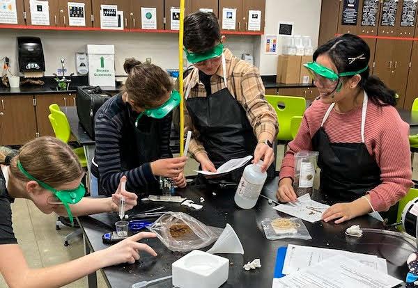 jsc2023e065214 (2/7/2023) --- Eighth grade student researchers work on their experiment, Microgreen Growth in Microgravity Environment, which will be included in the Nanoracks-National Center for Earth and Space Science Education-Orbiter-Student Spaceflight Experiments Program Mission 17 to ISS (Nanoracks-NCESSE-Orbiter-SSEP).
