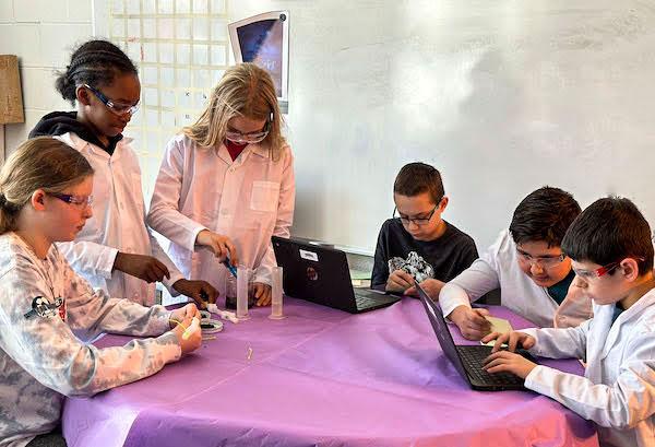 jsc2023e06522 (3/3/2023) --- Fifth grade student researchers from Walker-Winter Elementary School work on their experiment, Mushroom Germination in Microgravity, which will be included in the Nanoracks-National Center for Earth and Space Science Education-Orbiter-Student Spaceflight Experiments Program Mission 17 to ISS (Nanoracks-NCESSE-Orbiter-SSEP).