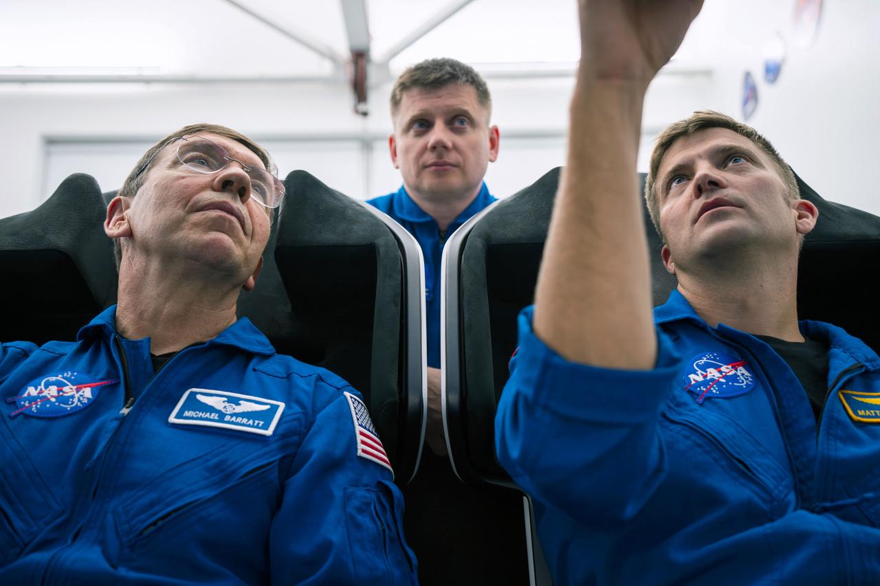 jsc2023e066249 (Oct. 15, 2023) --- SpaceX Crew-8 crew members (from left) Michael Barratt from NASA, Alexander Grebenkin from Roscosmos, and Matthew Dominick from NASA, are pictured during a training session at SpaceX headquarters in Hawthorne, California. Credit: SpaceX