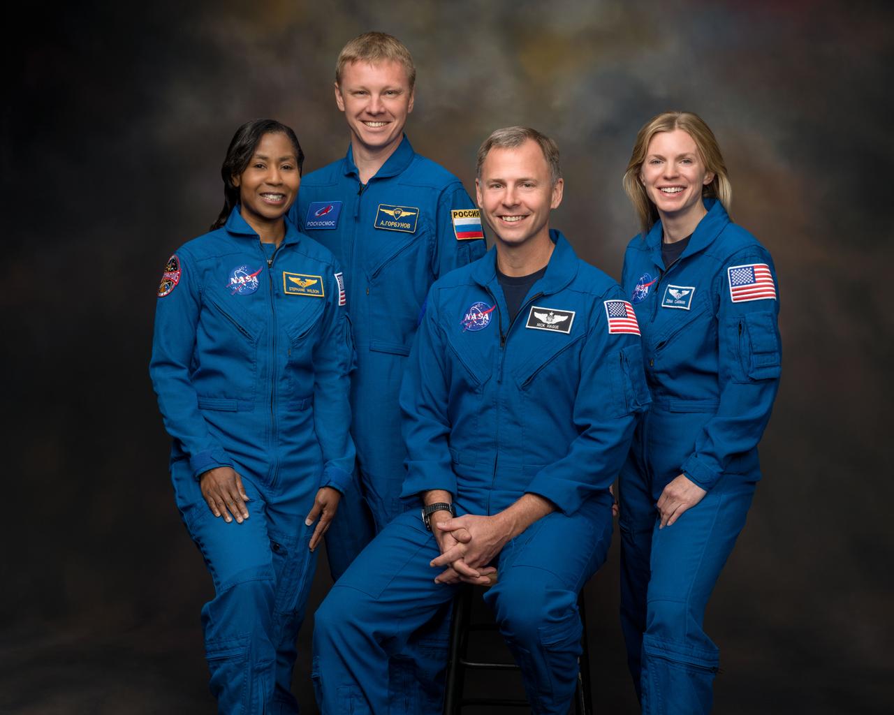 jsc2023e067561_alt (Oct. 27, 2023) --- The crew of NASA's SpaceX Crew-9 mission to the International Space Station poses for a portrait at NASA's Johnson Space Center in Houston, Texas. Pictured from left are, Mission Specialists Stephanie Wilson from NASA and Aleksandr Gorbunov from Roscosmos and Pilot Nick Hague and Commander Zena Cardman, both from NASA. Credit: NASA/Bill Stafford/Robert Markowitz