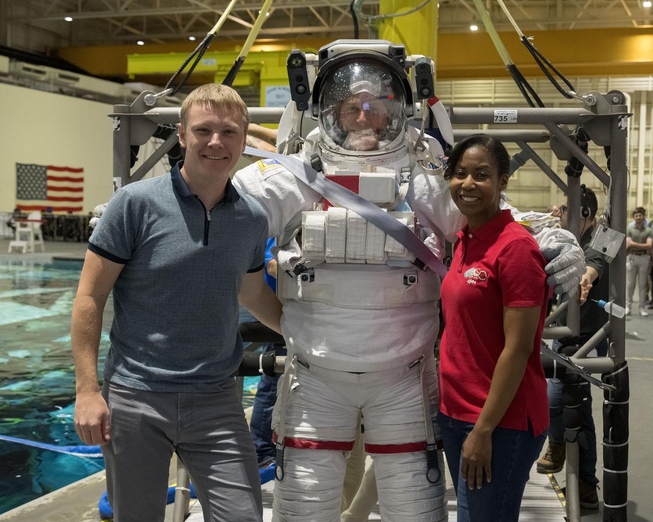 jsc2023e071582 (Nov. 6, 2023) --- NASA astronaut Nick Hague trains for a spacewalk at the Neutral Buoyancy Laboratory at NASA's Johnson Space Center in Houston, Texas, for the SpaceX Crew-9 mission to the International Space Station. Pictured with Hague, are Roscosmos cosmonaut Aleksandr Gorbunov and NASA astronaut Stephanie Wilson. Credit: NASA/Bill Stafford