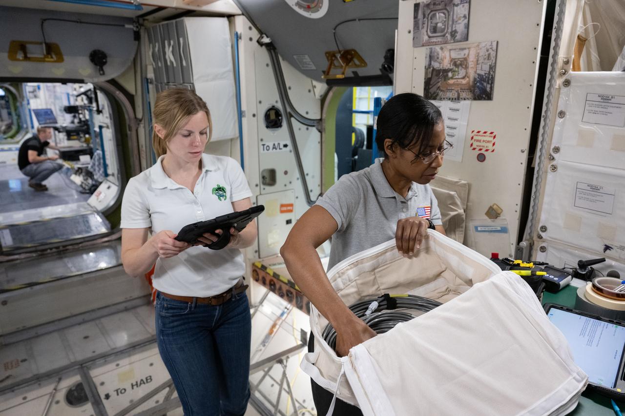 jsc2024e075406 (Nov. 7, 2023) --- (From left) NASA astronauts Zena Cardman and Stephanie Wilson train at the Space Vehicle Mockup Facility at NASA's Johnson Space Center in Houston, Texas, for the SpaceX Crew-9 mission to the International Space Station. Credit: NASA/James Blair