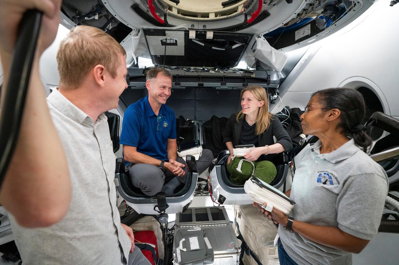 jsc2024e000258 (Jan. 8, 2024) --- The crew of NASA's SpaceX Crew-9 mission to the International Space Station trains inside a mockup of a Dragon cockpit at SpaceX headquarters in Hawthorne, California. Pictured from left are, Roscosmos cosmonaut Aleksandr Gorbunov and NASA astronauts Nick Hague, Zena Cardman, and Stephanie Wilson. Credit: SpaceX
