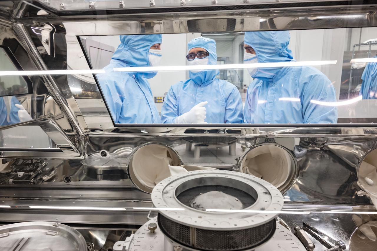 OSIRIS REx curation team attempting to remove the two stuck fasteners that are currently prohibiting the complete opening of the TAGSAM head. Photo Date: January 10, 2024. Location: Bldg. 31 - 2nd Floor - OSIRIS-REx lab. Photographer: Robert Markowitz