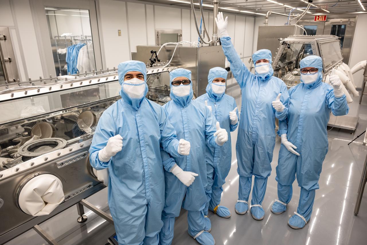 OSIRIS REx curation team attempting to remove the two stuck fasteners that are currently prohibiting the complete opening of the TAGSAM head. Photo Date: January 10, 2024. Location: Bldg. 31 - 2nd Floor - OSIRIS-REx lab. Photographer: Robert Markowitz
