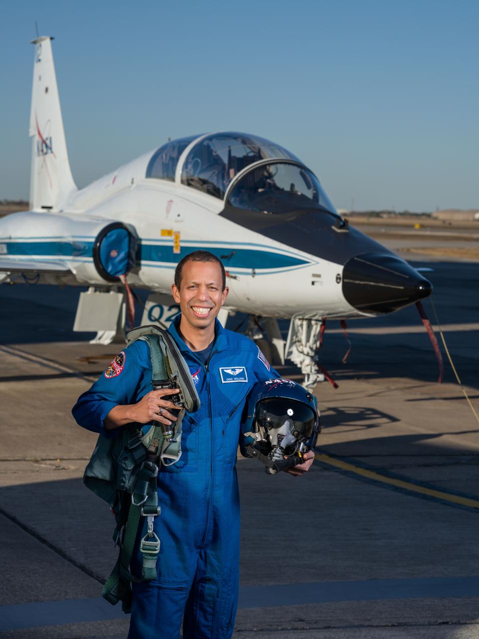 jsc2024e005699 (Jan. 9, 2024) --- NASA astronaut Chris Williams poses for a photo in front of a T-38 jet at Ellington Field in Houston, Texas.