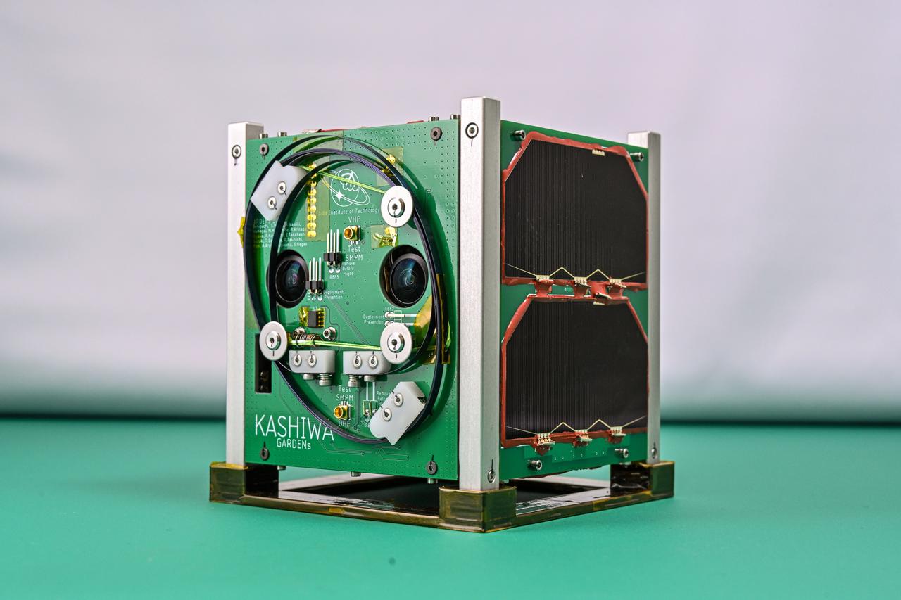 jsc2024e006095 (11/8/2023) --- Image of the KASHIWA flight units. KASHIWA, developed by the Growing Advanced and Refined space Development ENgineering succession and under the satellite (GARDENs) program is a project from Chiba Institute of Technology. The KASHIWA mission is to demonstrate stereo cameras for ranging, to demonstrate the APRS (Automatic Packet Reporting System) for digipeating through the satellite, to demonstrate analog audio using geomagnetic sensor and earth observation with camera.
