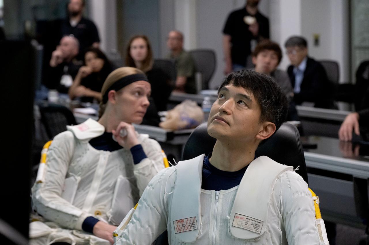 jsc2023e009094 (Jan. 22, 2024) --- SpaceX Crew-10 members Pilot Nichole Ayers of NASA and Mission Specialist Takuya Onishi of JAXA (Japan Aerospace Exploration Agency), surrounded by support personnel, prepare for spacewalk training in the Neutral Buoyancy Laboratory at NASA's Johnson Space Center.