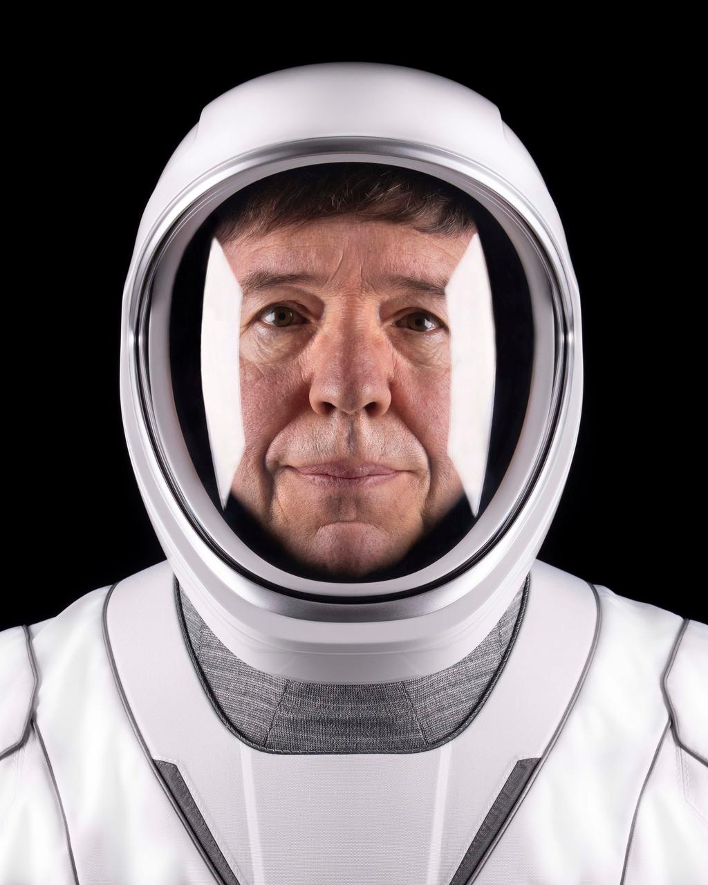 jsc2024e01170 (Dec. 3, 2023) --- SpaceX Crew-8 Pilot Michael Barratt of NASA's Commercial Crew Program poses for a portrait in his pressure suit at SpaceX headquarters in Hawthorne, California. Credit: SpaceX