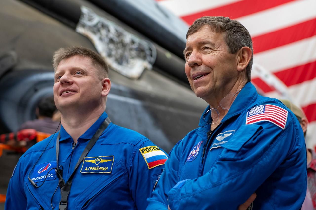 jsc2024e011741 (Oct. 12, 2023) --- SpaceX Crew-9 crew members Alexander Grebenkin and Michael Barratt, Mission Specialist and Pilot, respectively, are pictured inside SpaceX Hangar X at the Kennedy Space Center in Florida. Hangar X supports Falcon 9 rocket refurbishment and houses administration offices. Credit: SpaceX