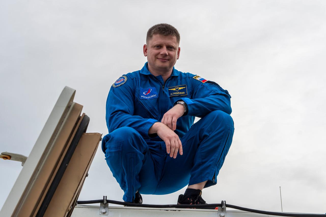 jsc2024e011754 (Oct. 12, 2023) --- SpaceX Crew-8 Mission Specialist Alexander Grebenkin poses for a photo outside the emergency egress vehicle at NASA's Kennedy Space Center's Launch Pad 39A in Florida. Astronauts would use the emergency egress vehicle to quickly leave the launch area in the unlikely event of an emergency. Credit: SpaceX
