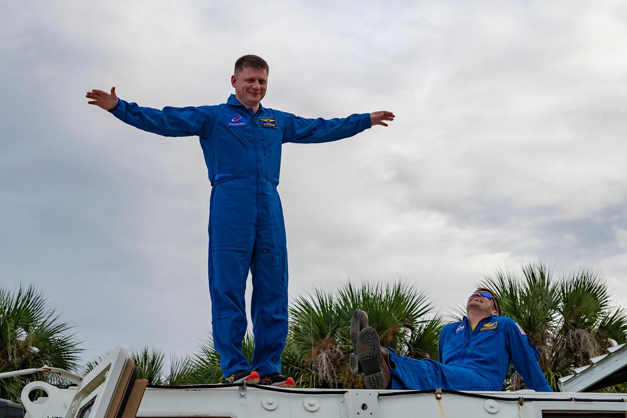 jsc2024e011755 (Oct. 12, 2023) --- SpaceX Crew-8 Mission Specialist Alexander Grebenkin poses for a photo outside the emergency egress vehicle at NASA's Kennedy Space Center's Launch Pad 39A in Florida. Astronauts would use the emergency egress vehicle to quickly leave the launch area in the unlikely event of an emergency. Credit: SpaceX