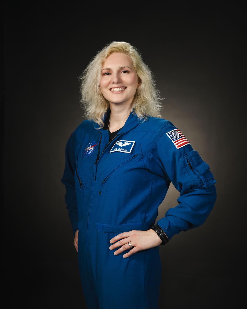   jsc2024e013667 (February 8, 2024) --- NASA astronaut Deniz Burnham poses for a portrait at NASA’s Johnson Space Center in Houston, Texas. Credit: NASA/ Josh Valcarcel