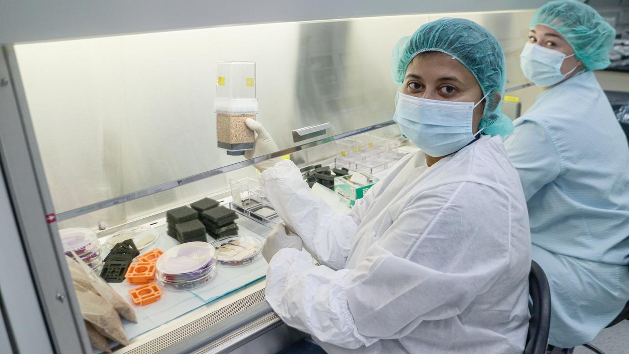 jsc2024e016230 (9/20/2023) --- Dr. Handakumbura, Principal Investigator for C4 Photosynthesis in Space (C4 Space) (APEX-09), is pictured alongside Payload Engineer Sarah Lemire as the NASA team assembles Plant Growth Systems during the APEX-09 Experiment Verification test at NASA's Kennedy Space Center. Image courtesy of Dr. Handakumbura.