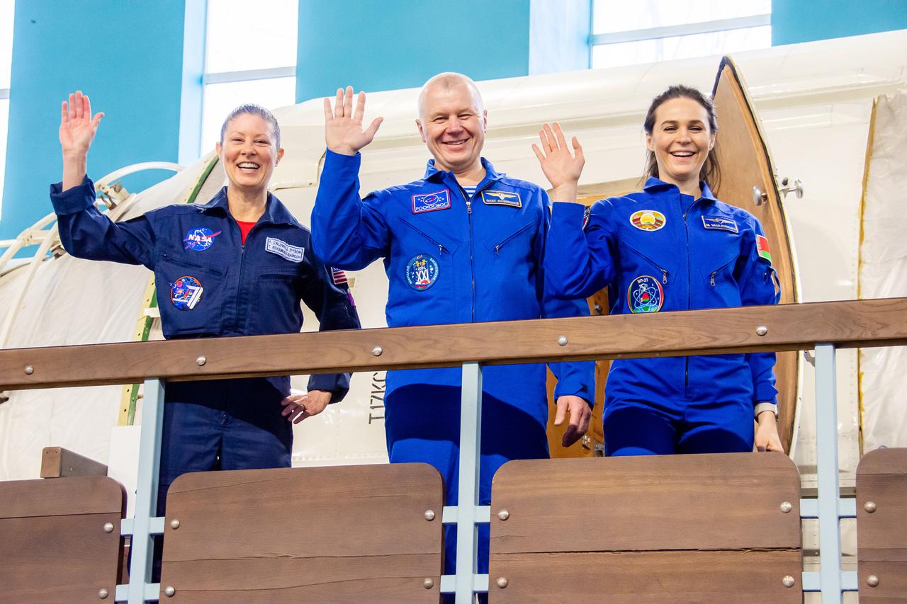 jsc2024e016953 (Feb. 28, 2024) --- Soyuz MS-25 crew members (from left) Tracy Dyson from NASA, Oleg Novitskiy from Roscosmos, and Belarus spaceflight participant Marina Vasilevskaya wave to photographers during their crew qualification exams at the Gagarin Cosmonaut Training Center in Star City, Russia. Credit: GCTC/Roscosmos