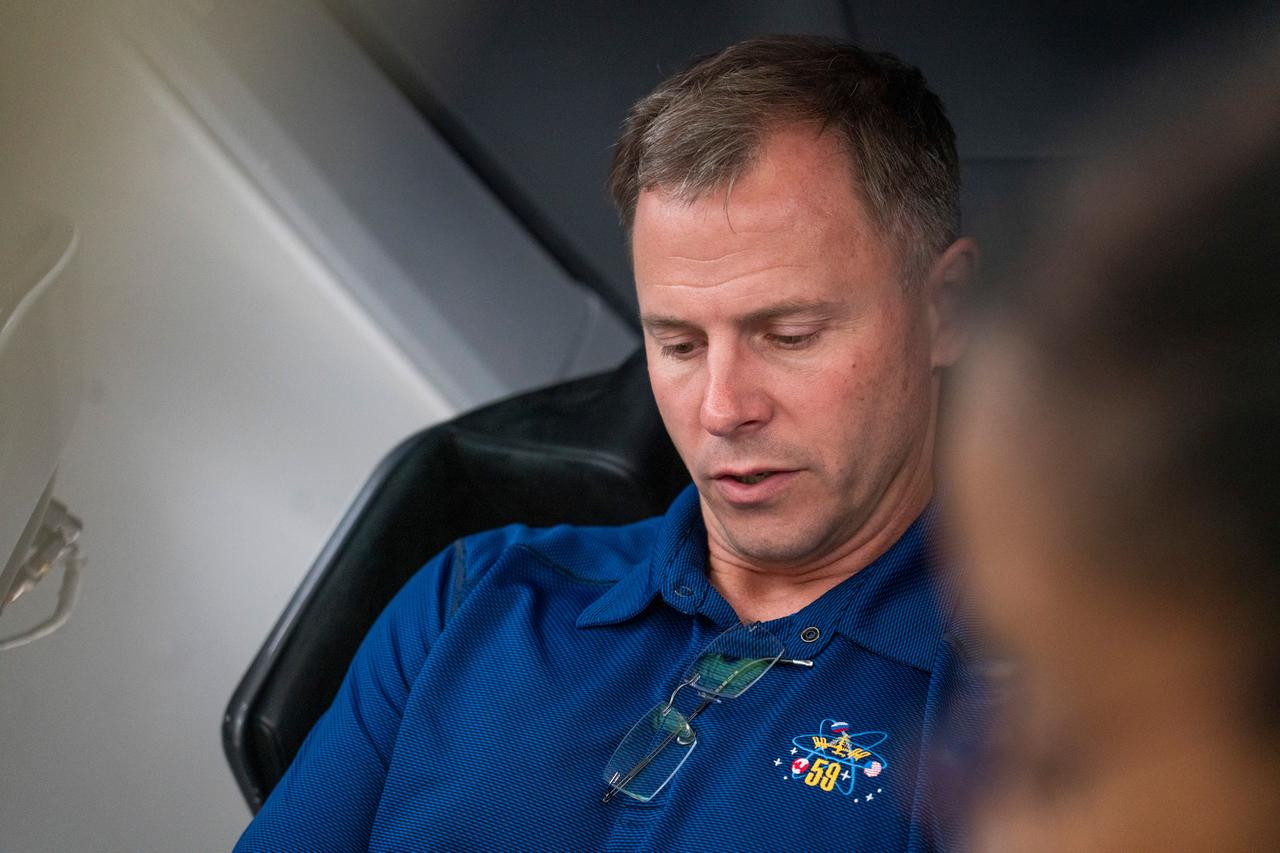 jsc2024e026552 (Nov. 22, 2023) --- NASA astronaut and SpaceX Crew-9 Pilot Nick Hague focuses on his training inside a mockup of a Dragon spacecraft cockpit at SpaceX headquarters in Hawthorne, California. Credit: SpaceX